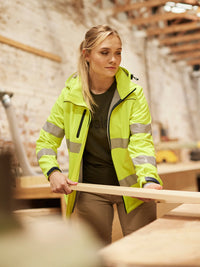 WOMEN’S TAPED HI VIS SOFT SHELL JACKET WITH HOOD